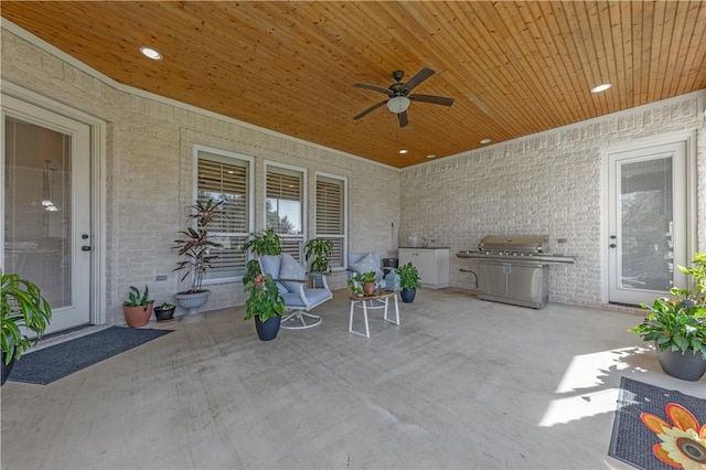 view of patio featuring ceiling fan and grilling area