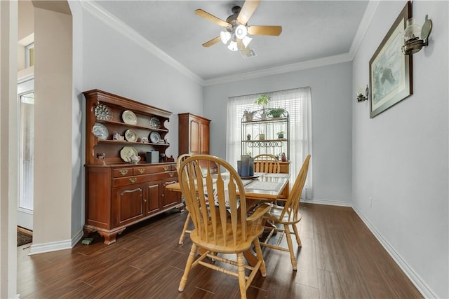 dining space with crown molding, ceiling fan, and dark hardwood / wood-style flooring