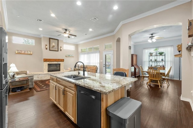 kitchen with sink, dishwasher, a kitchen island with sink, ornamental molding, and dark hardwood / wood-style flooring