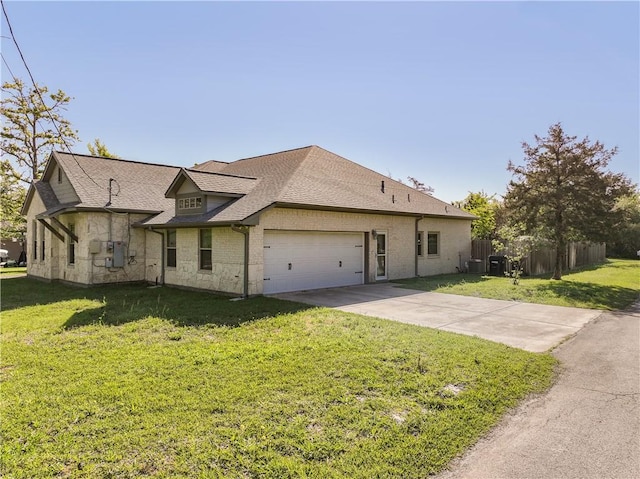 view of front of property with a garage and a front yard