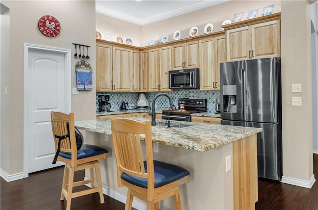 kitchen with light stone countertops, a kitchen island with sink, a kitchen bar, and stainless steel fridge with ice dispenser