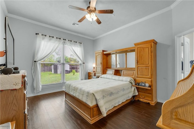 bedroom featuring dark wood-type flooring, ceiling fan, and crown molding