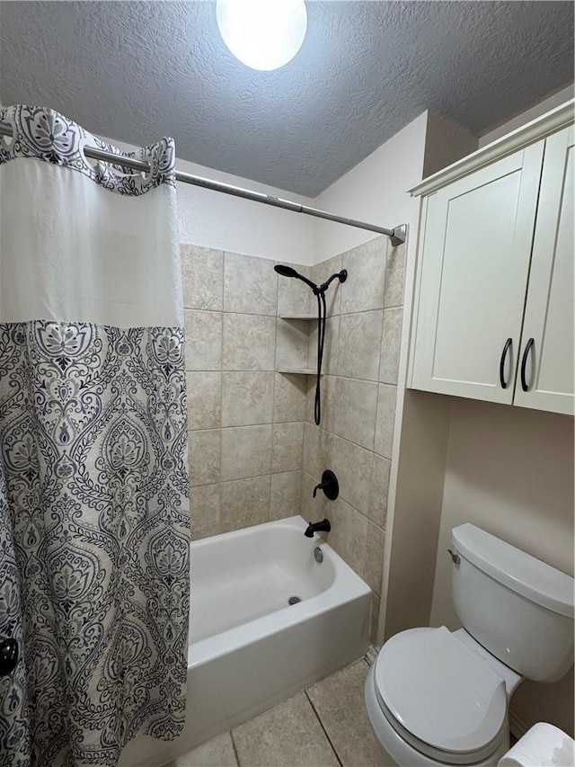 bathroom with shower / tub combo with curtain, tile patterned floors, toilet, and a textured ceiling