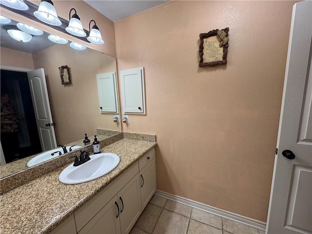 bathroom with vanity and tile patterned floors