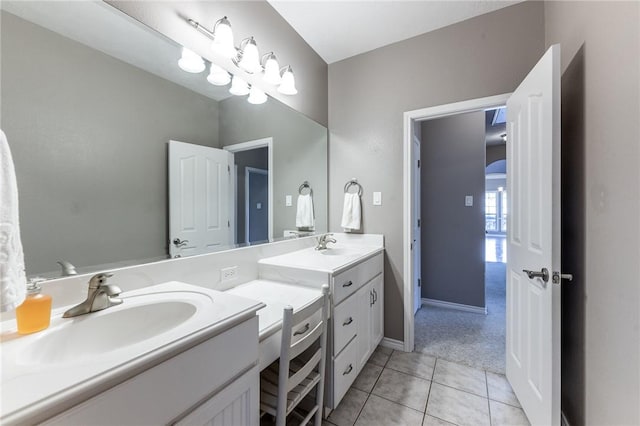 bathroom with tile patterned flooring and vanity