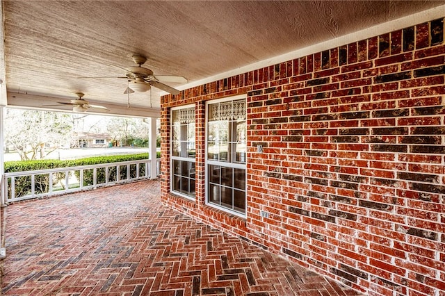 view of patio featuring ceiling fan and a porch