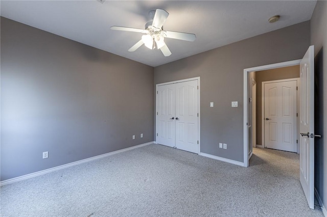 unfurnished bedroom with light carpet, ceiling fan, and a closet