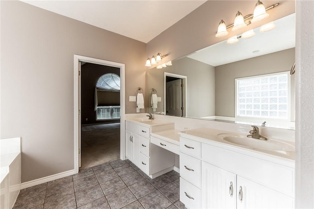 bathroom with a tub to relax in and vanity