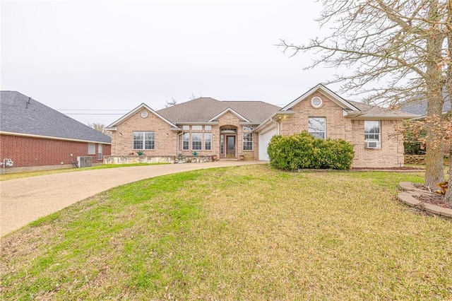 ranch-style home with central AC and a front yard