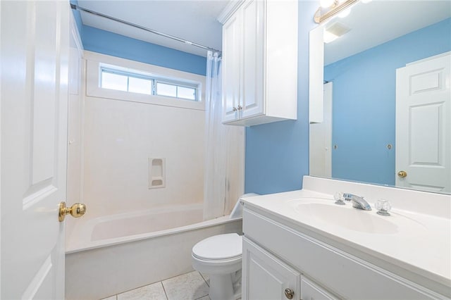 full bathroom with tile patterned floors, shower / bath combo with shower curtain, vanity, and toilet