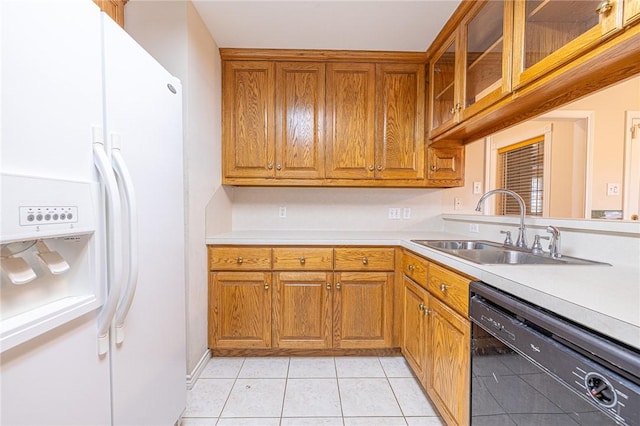 kitchen with sink, white fridge with ice dispenser, light tile patterned flooring, and dishwasher