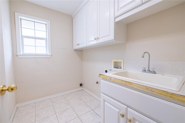 laundry area featuring hookup for a washing machine, electric dryer hookup, light tile patterned floors, sink, and cabinets