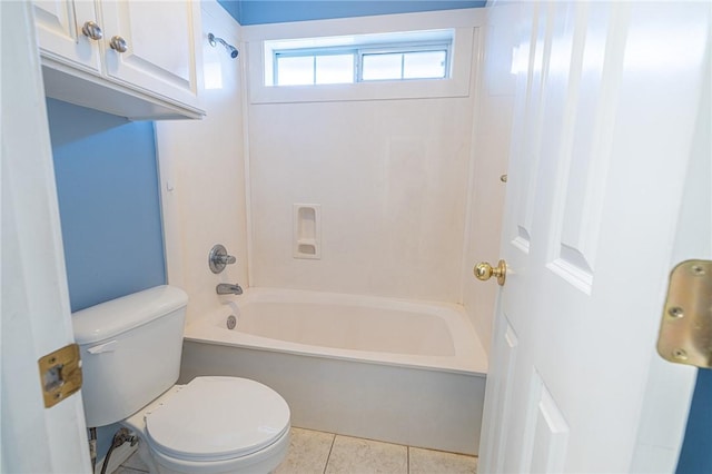 bathroom with tile patterned floors, toilet, and  shower combination