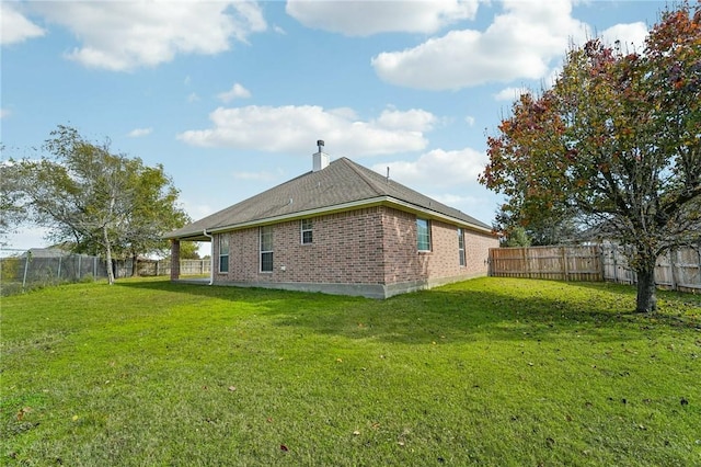 view of home's exterior with a lawn