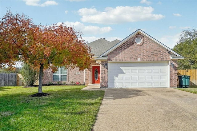 view of front of home featuring a garage and a front lawn