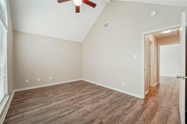 interior space featuring hardwood / wood-style floors, high vaulted ceiling, ceiling fan, and beam ceiling