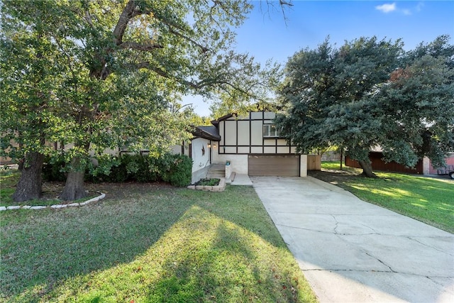 view of front of home featuring a garage and a front lawn