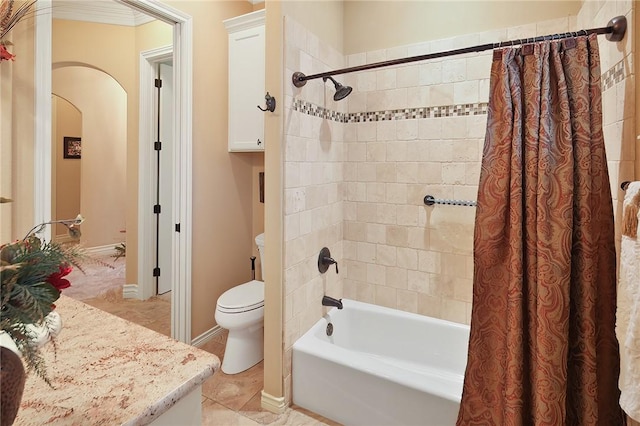 bathroom featuring shower / bath combination with curtain, tile patterned floors, and toilet