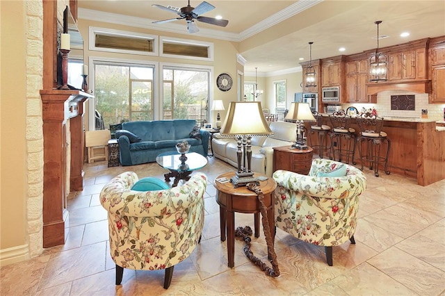 living room with crown molding and ceiling fan