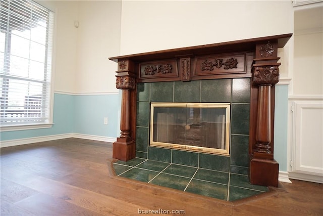 interior details featuring a fireplace and hardwood / wood-style flooring