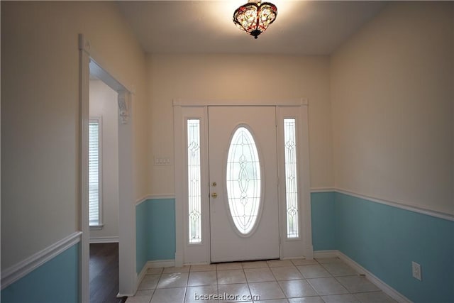 foyer featuring light tile patterned flooring