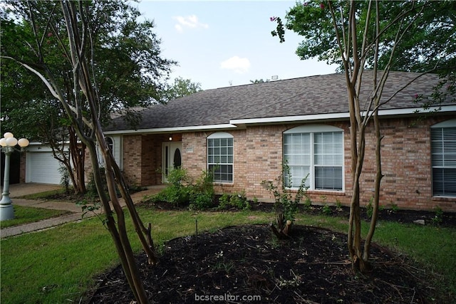 ranch-style home with a front lawn