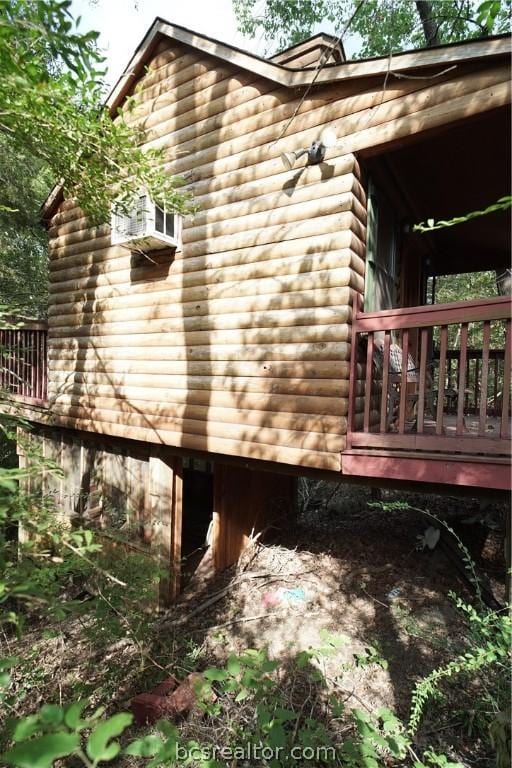 view of home's exterior featuring a wooden deck