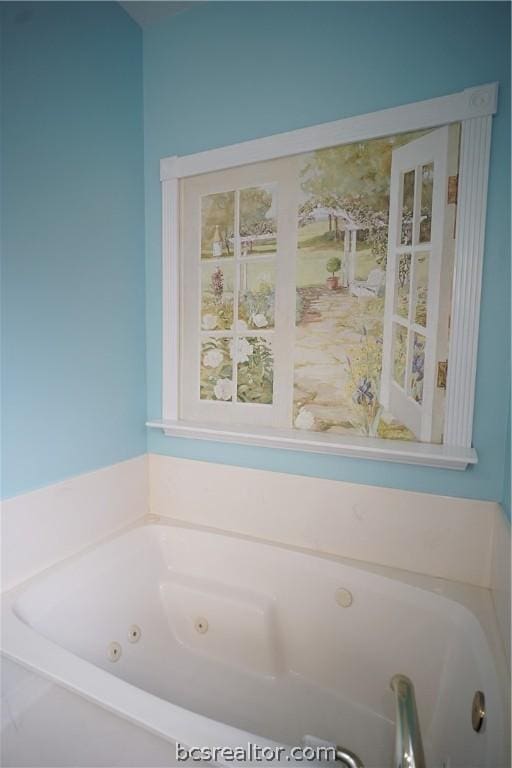 bathroom featuring a washtub