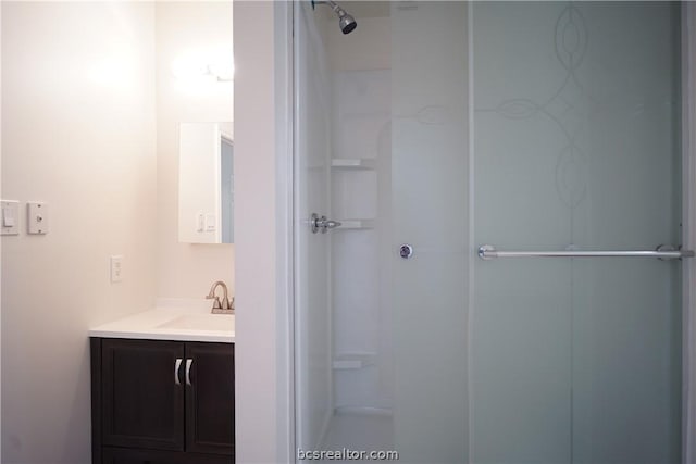 bathroom with vanity and walk in shower