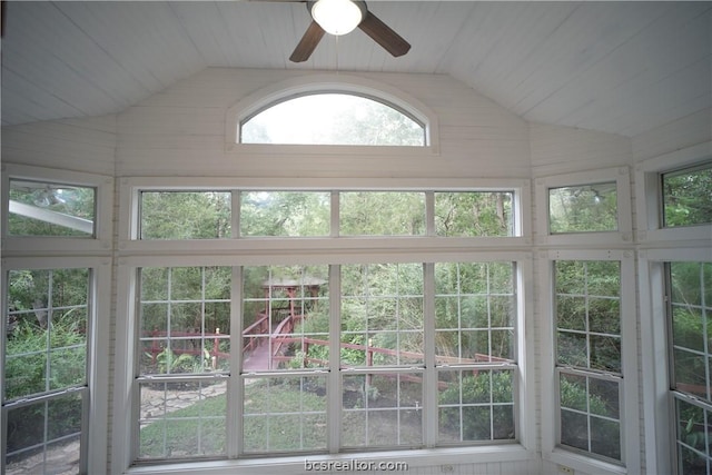 unfurnished sunroom featuring ceiling fan and lofted ceiling