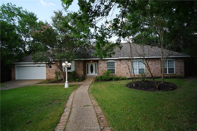 ranch-style house with a front yard and a garage