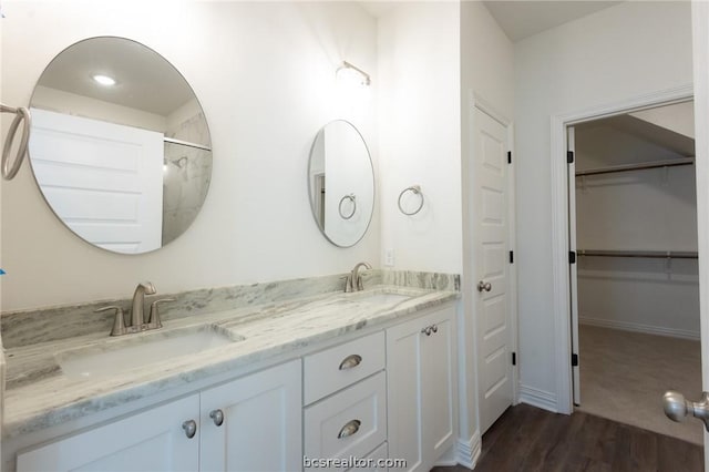 bathroom featuring vanity and wood-type flooring