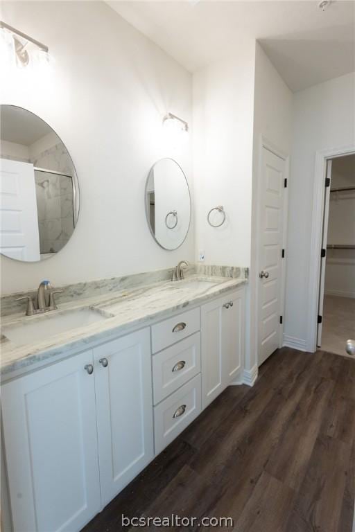 bathroom featuring vanity and hardwood / wood-style flooring