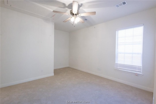 carpeted empty room featuring ceiling fan