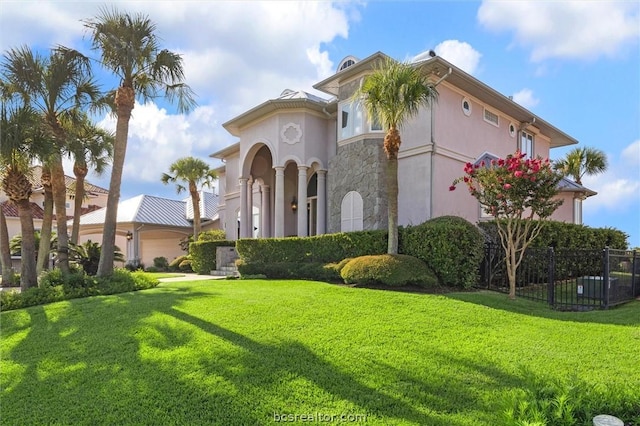 view of front facade featuring a garage and a front yard