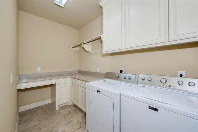 washroom with separate washer and dryer and cabinets