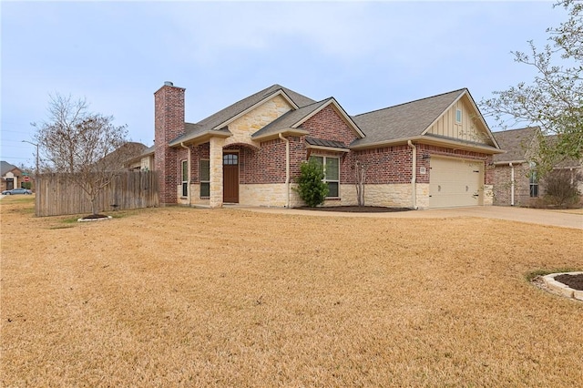 view of front facade featuring a garage and a front yard