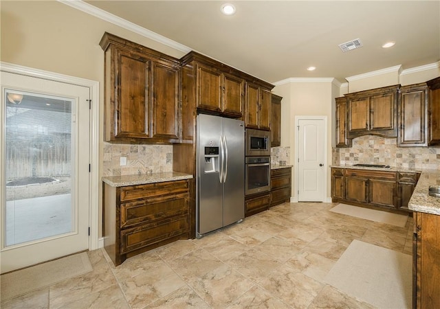 kitchen with stainless steel appliances, ornamental molding, light stone countertops, and tasteful backsplash