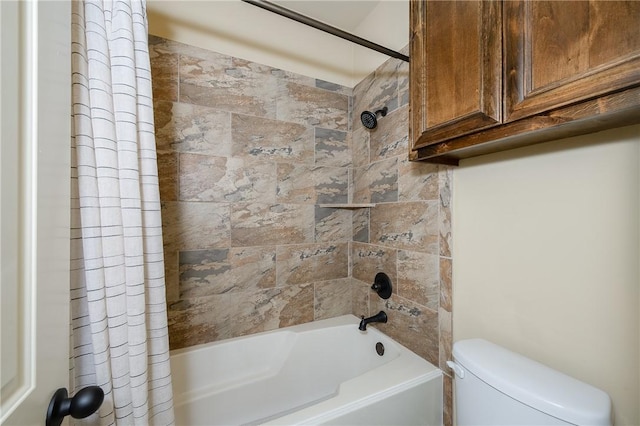 bathroom with shower / tub combo with curtain and toilet