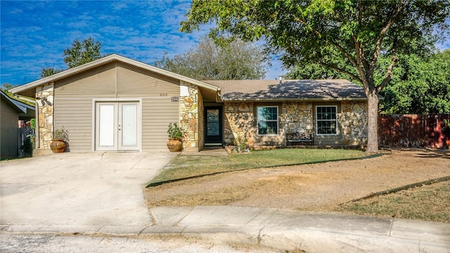 ranch-style home featuring french doors