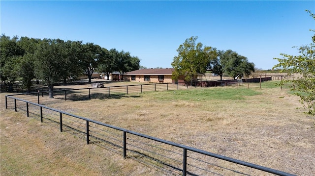 view of yard with a rural view