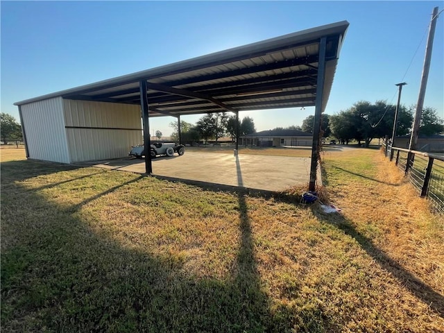 view of vehicle parking featuring a lawn