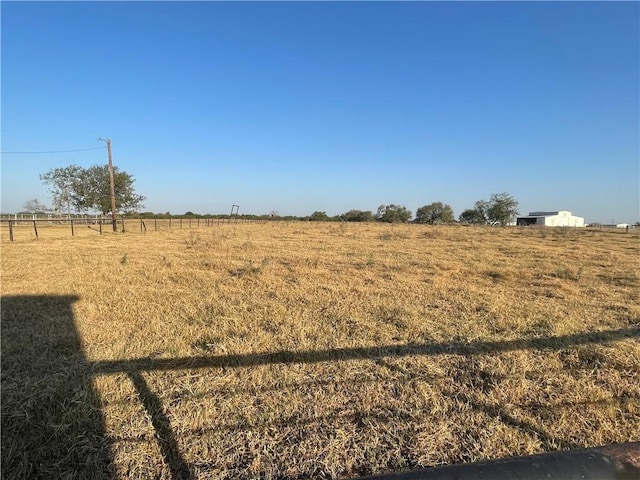 view of yard with a rural view