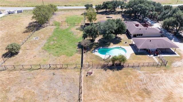 birds eye view of property with a rural view