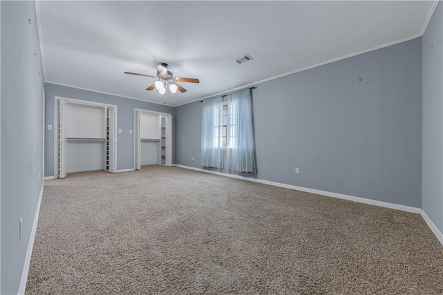 unfurnished bedroom featuring carpet floors, ceiling fan, and ornamental molding