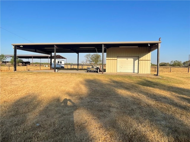 exterior space featuring a carport and a rural view