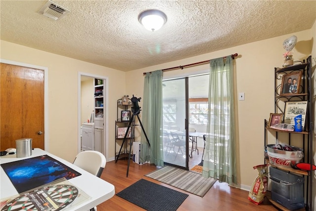 10072 Riley Green Rd, Franklin, TX 77856 - office area with wood finished floors and a textured ceiling