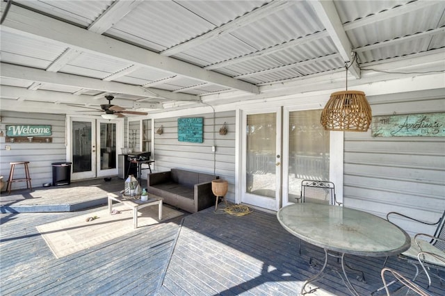 deck with grilling area, french doors, and ceiling fan