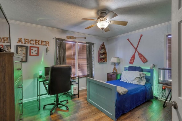 bedroom with hardwood / wood-style floors, ornamental molding, and a textured ceiling