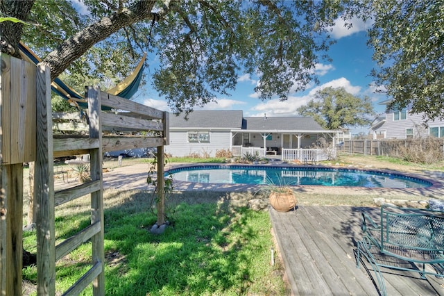 view of pool with a wooden deck